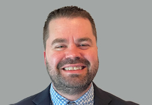 Headshot of Miles Herrick, founder of QuickFlip Digital