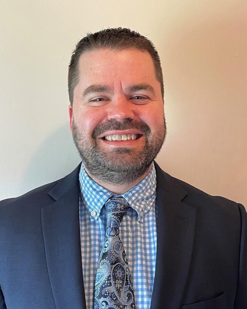 Headshot of Miles Herrick, founder of QuickFlip Digital